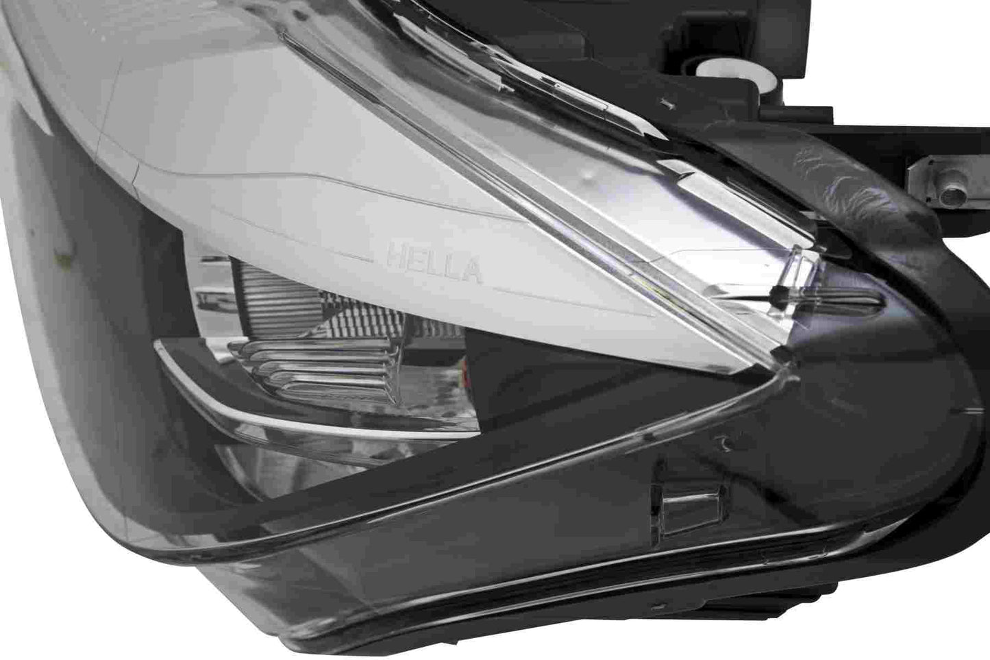 Package View of Front Left Headlight Assembly HELLA 012101951